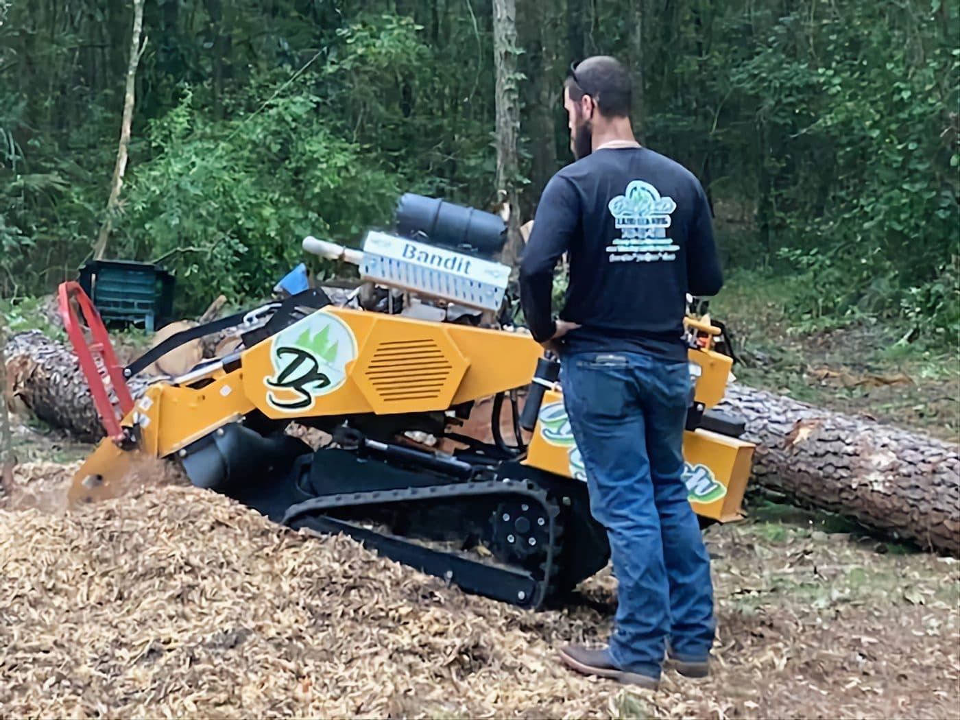 Dirty South Tree Services crew operating the stump grinder on a job site